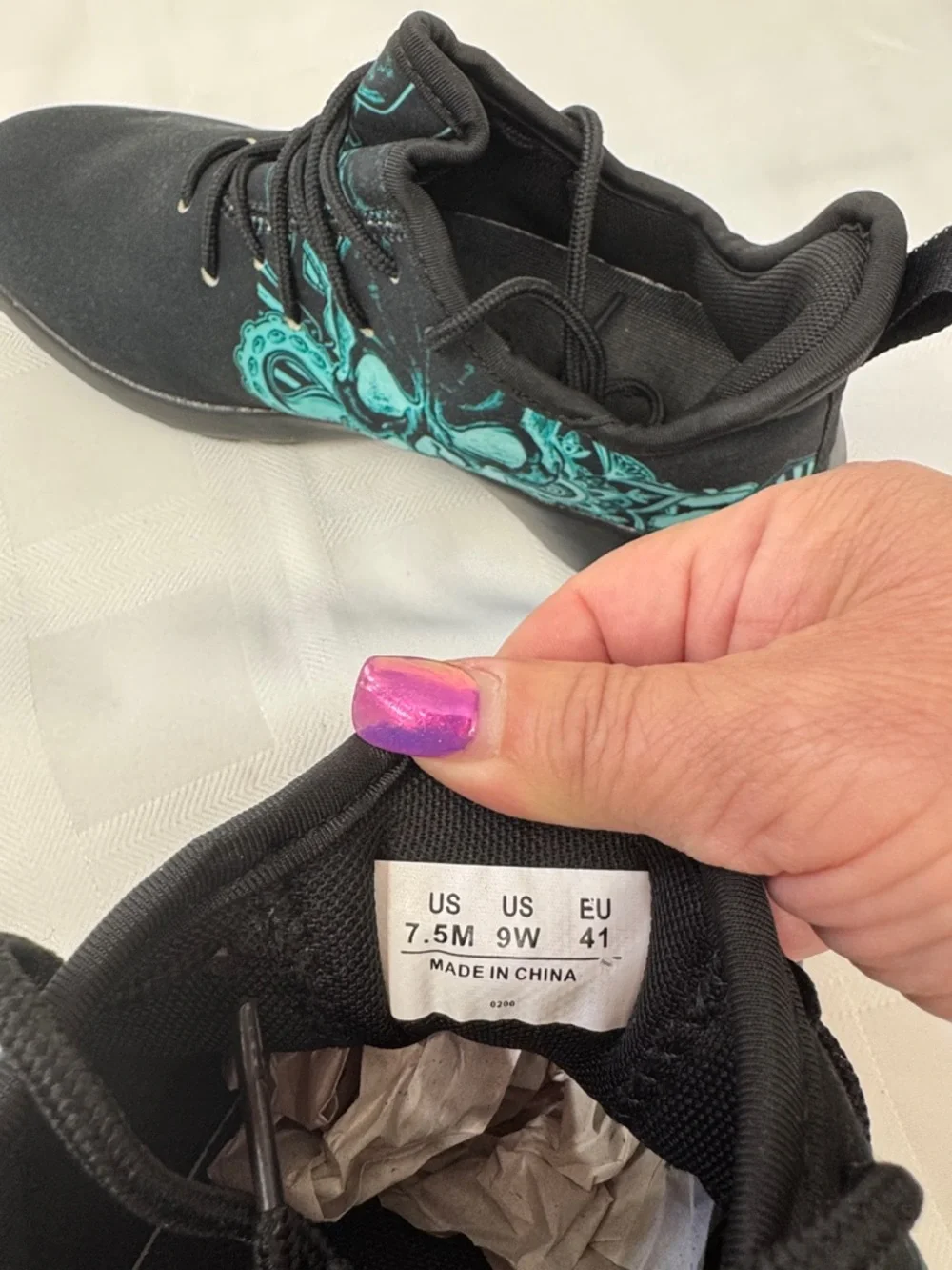 Unisex Black Lightweight Sneakers with Teal Skull Accent